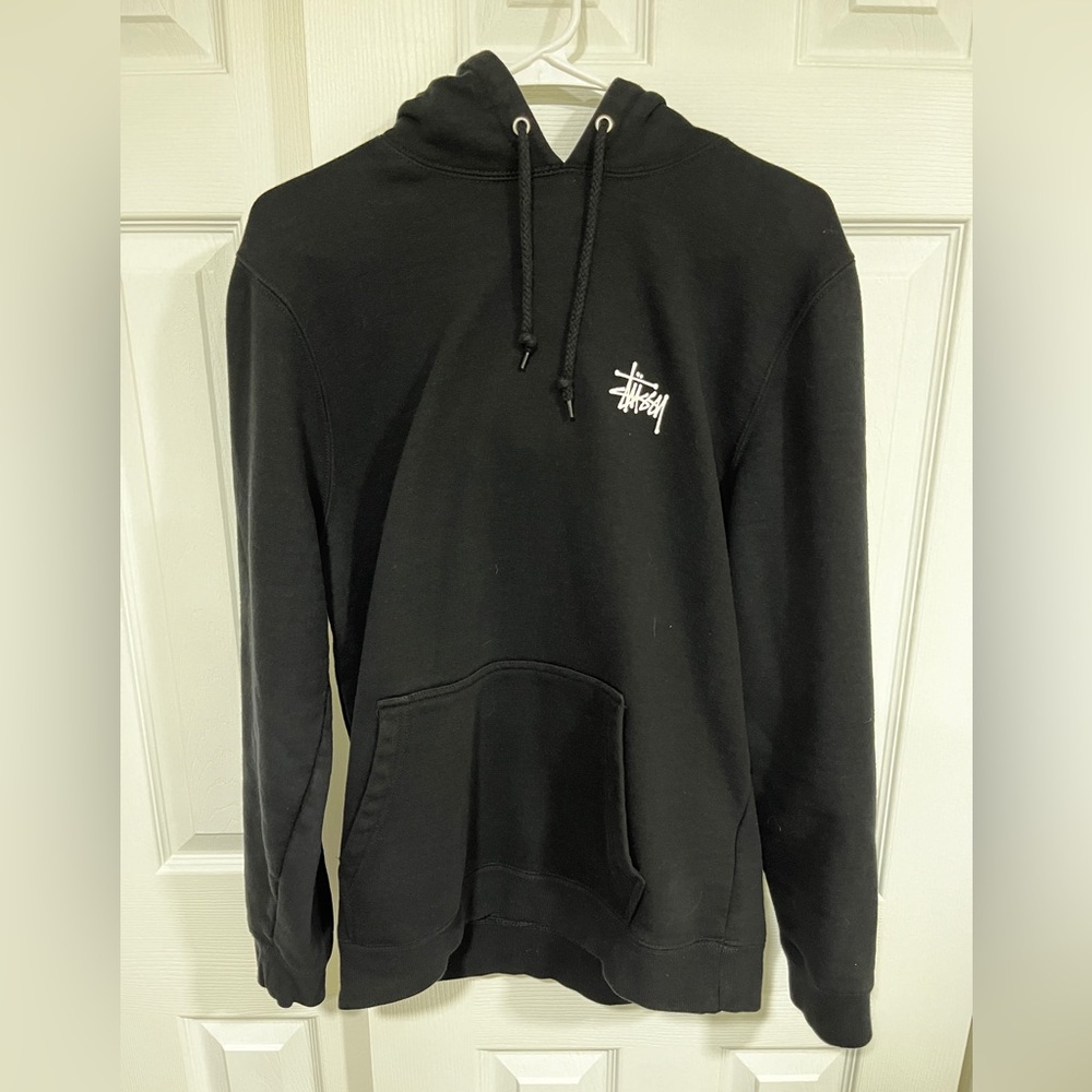 Authentic Stüssy pull-over sweatshirt Size M. black with large back logo. New